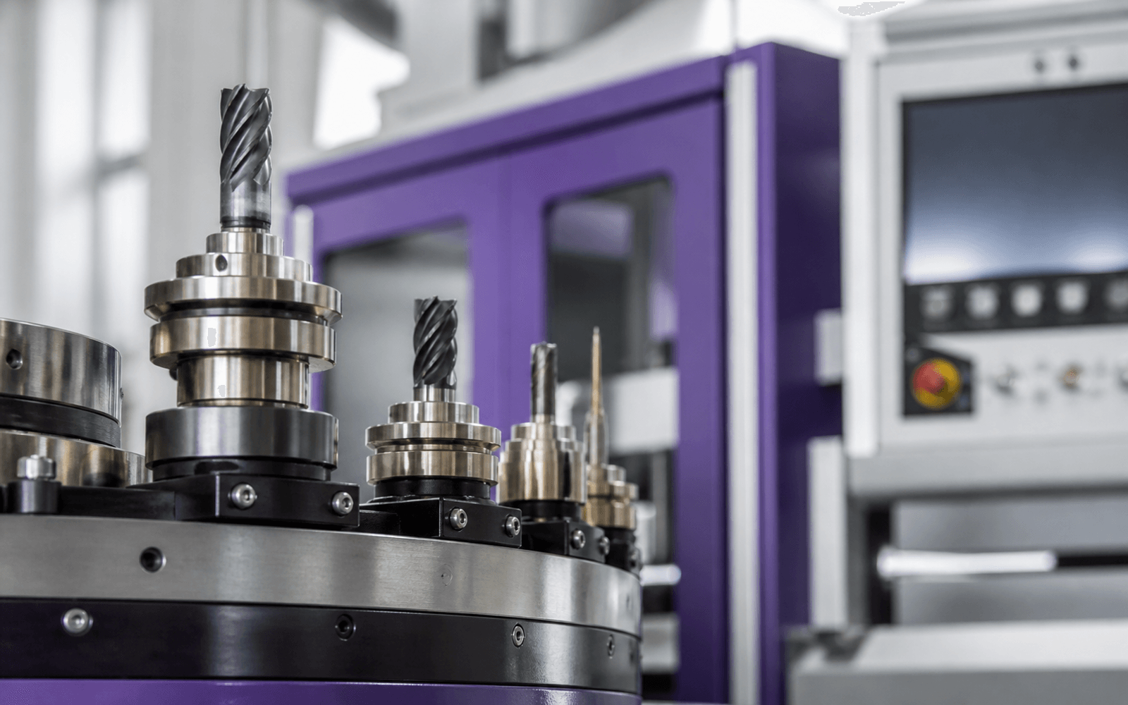 Precision machine tools and purple equipment cabinets in close view
